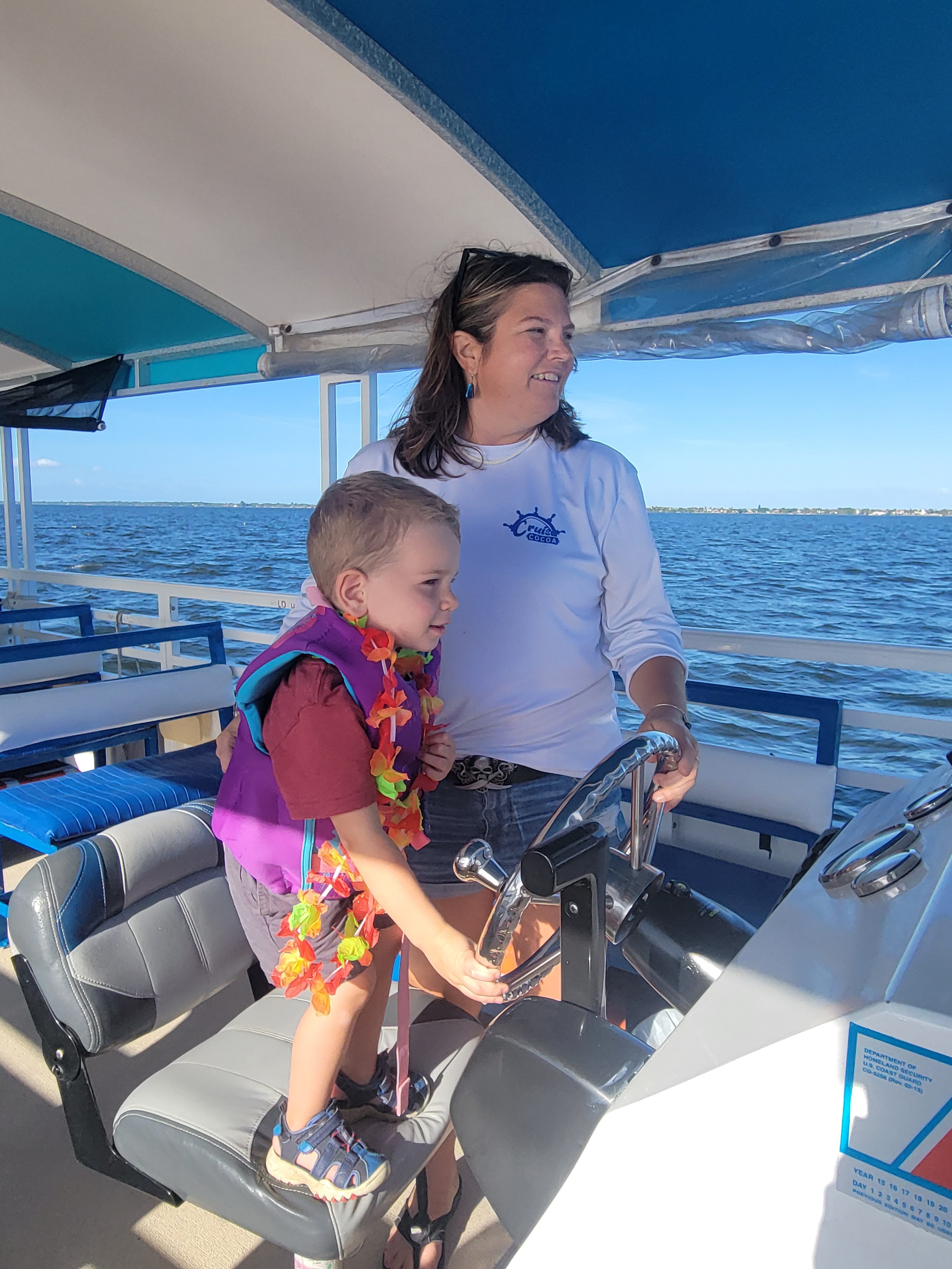 cruise cocoa beach florida kid driving boat